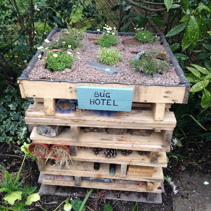 a wooden pallet filled with lots of plants