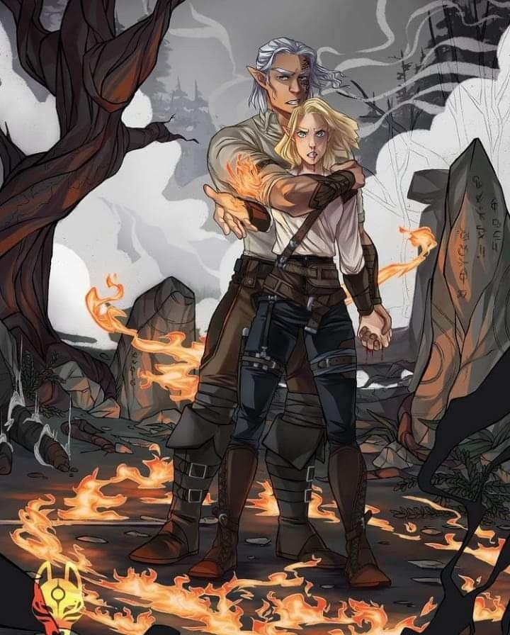 an image of a man and woman hugging in front of some rocks with fire coming from them