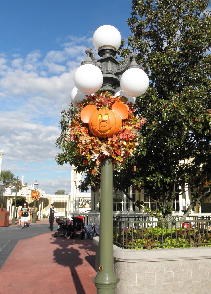 a street light with pumpkin decorations on it