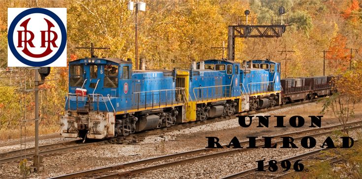 the union railroad logo is shown above an image of a train on tracks with trees in the background