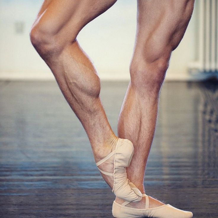 the legs and feet of a man in ballet shoes