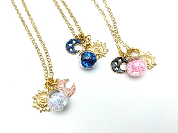 "A made to order sun, moon and stars charm pendant necklace with your choice of star and moon colors. Sturdy 5 mm cable chain with a rhinestone accent on the end can be adjusted up to 20\" Charms range from 15-20 mm Want a different length? Let us know what you need at checkout. Shorter lengths are at no cost. Longer chains may incur an additional charge. US SHIPPING: US orders over $35 or for 3 or more items ship free via first class mail. Orders over $150 receive a free priority mail upgrade. Chill Fashion, Sun Moon And Stars, Star Charm Necklace, Star And Moon, Types Of Gifts, Sun Moon Stars, Gold Sun, Gold And Silver Rings, Charm Pendant Necklace