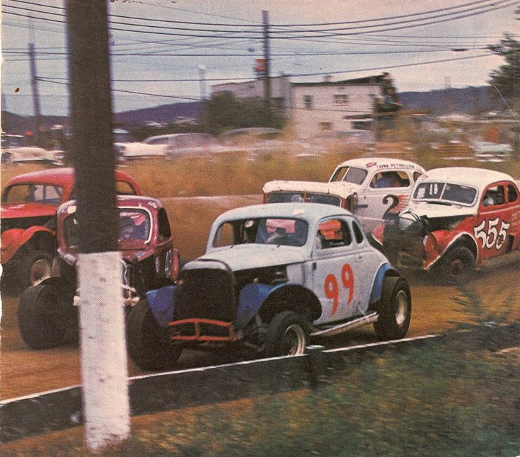 an old time race with cars going around the track