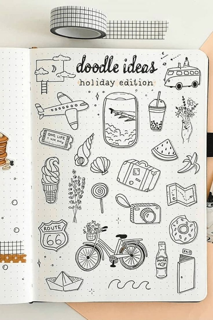 an open notebook with doodle images on it