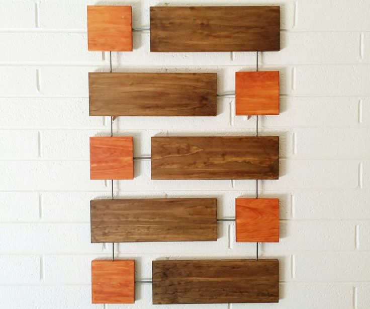 some wood pieces are hanging on the wall