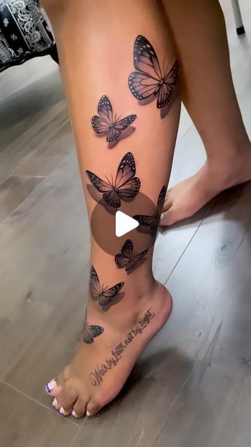 a woman's leg with butterflies on it and the words, love is in the air