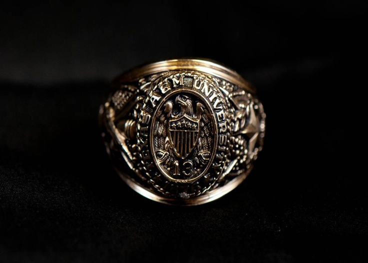 a gold ring with an eagle on it