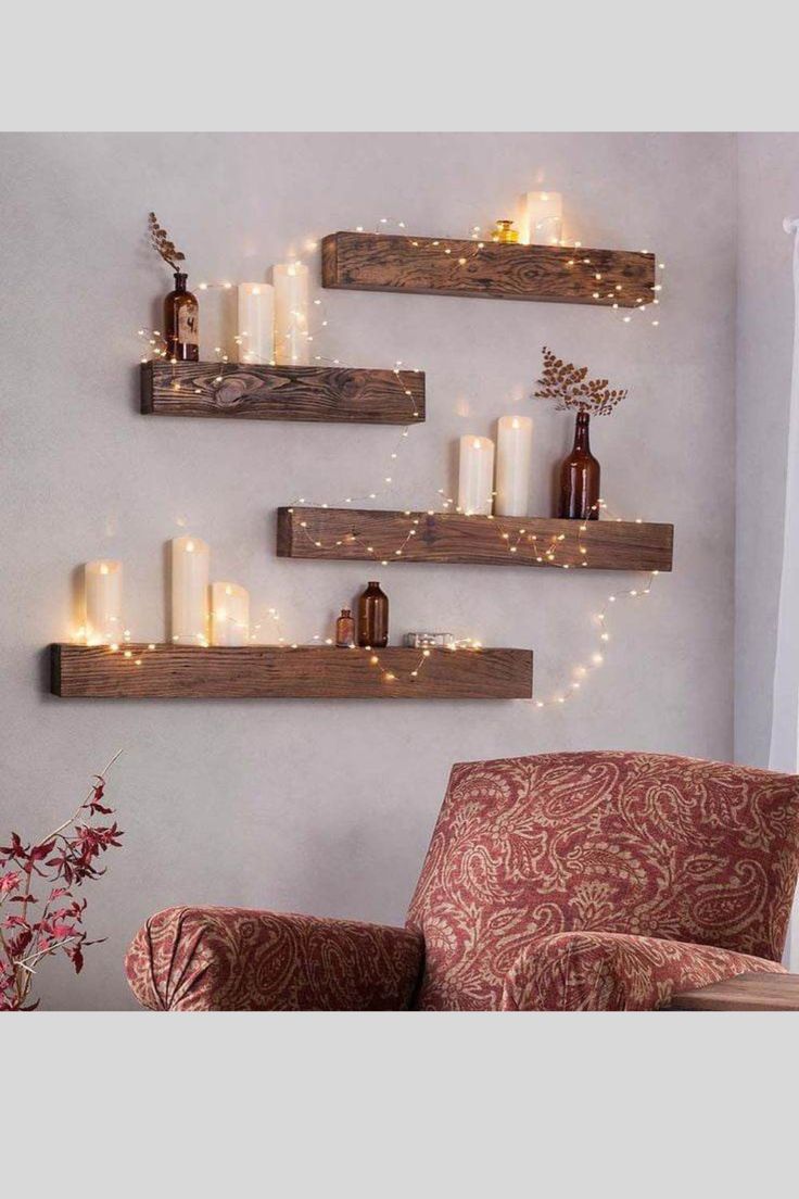 two pictures with candles on the wall