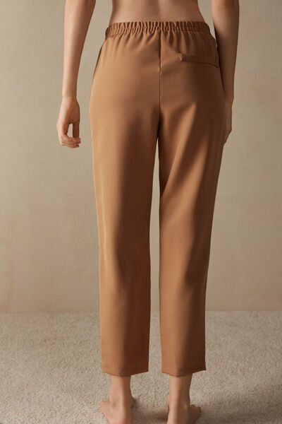 Full-length trousers featuring two pockets, faux back pocket and covered elasticated waist. Ankle-length Elastane Pants With Pockets, Tapered Leg Elastane Pants With Pockets, Business Casual Bottoms With Pockets, Straight Elastane Dress Pants With Pockets, Elastane Trousers With Pockets, Stretch Workwear Pants With Hidden Pockets, Stretch Pants With Hidden Pockets For Work, Classic Ankle-length Pants With Side Pockets, Business Casual Trousers With Hidden Pockets