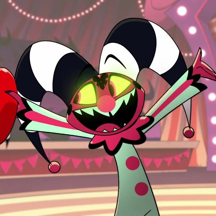 an animated cartoon character with big eyes and large teeth, holding onto a red object