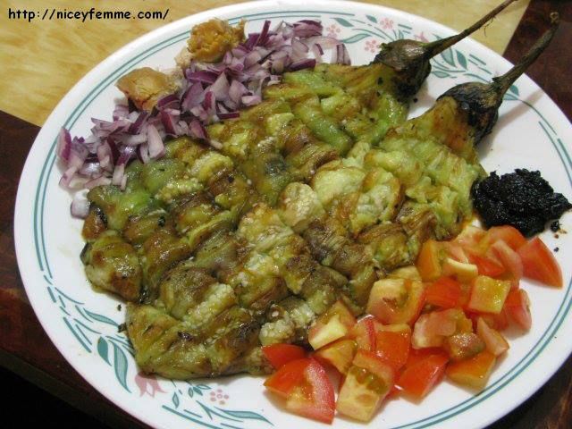 a white plate topped with meat and vegetables