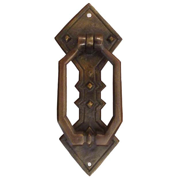 an old style door handle on a white background