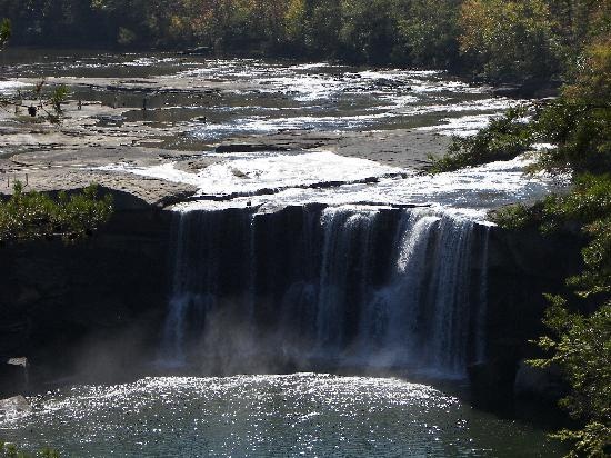 a large waterfall in the middle of a river