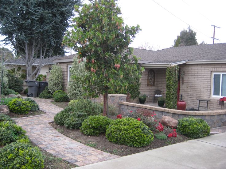 a house with landscaping in front of it