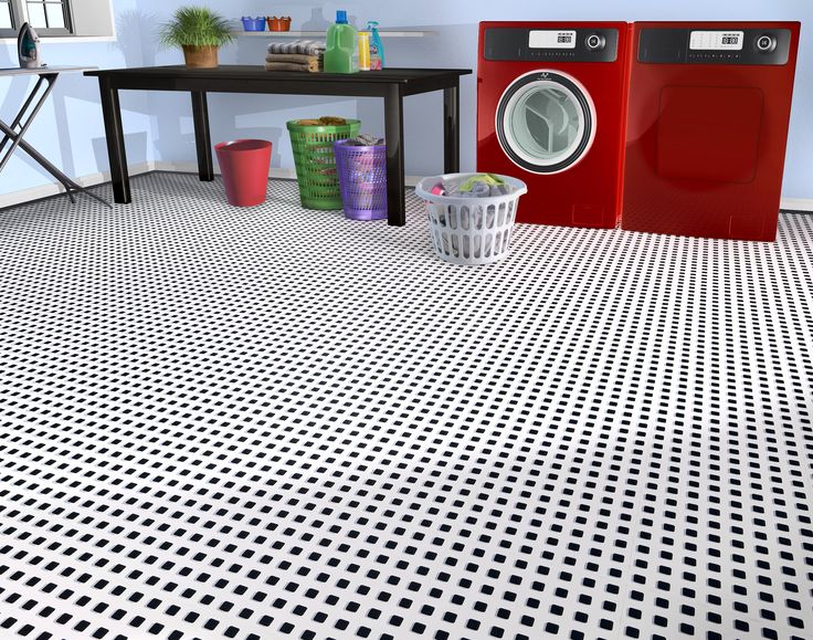 an image of a laundry room setting with washer and dryer on the floor