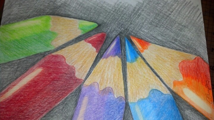 colored pencils arranged in the shape of an umbrella