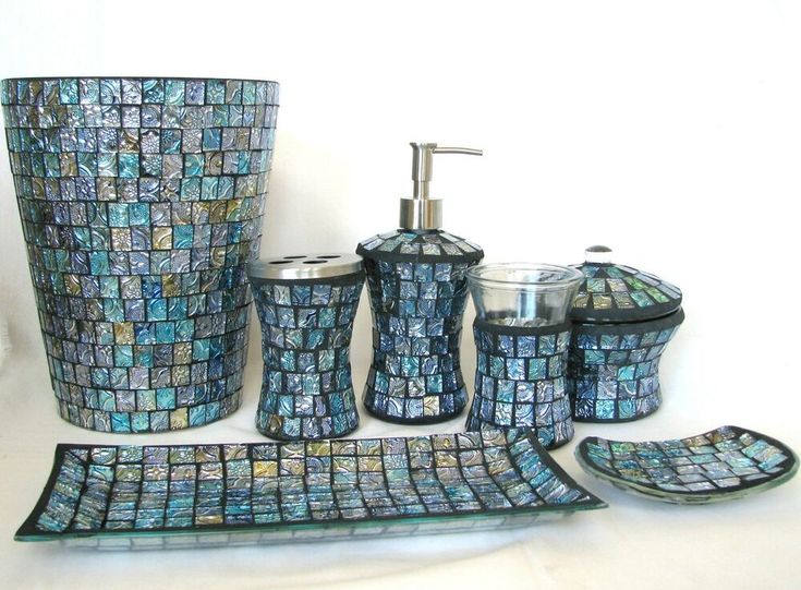 a bathroom set with blue mosaic tiles on it