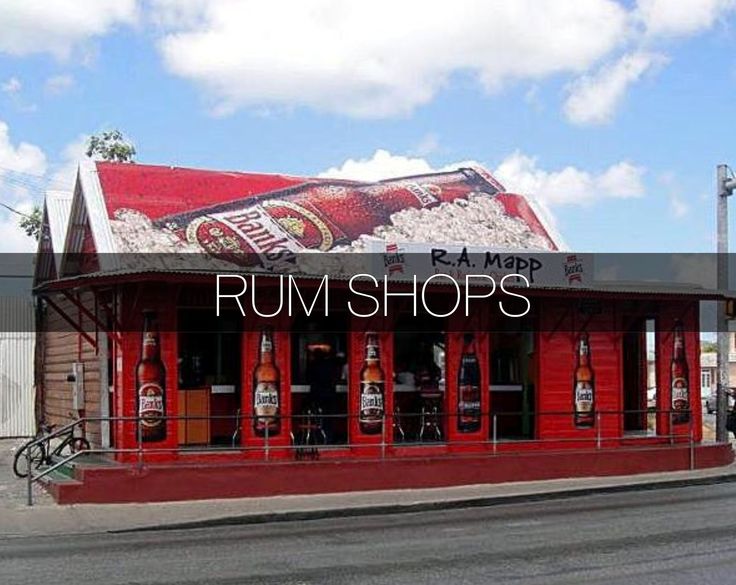 a red building with an advertisement for rum shops