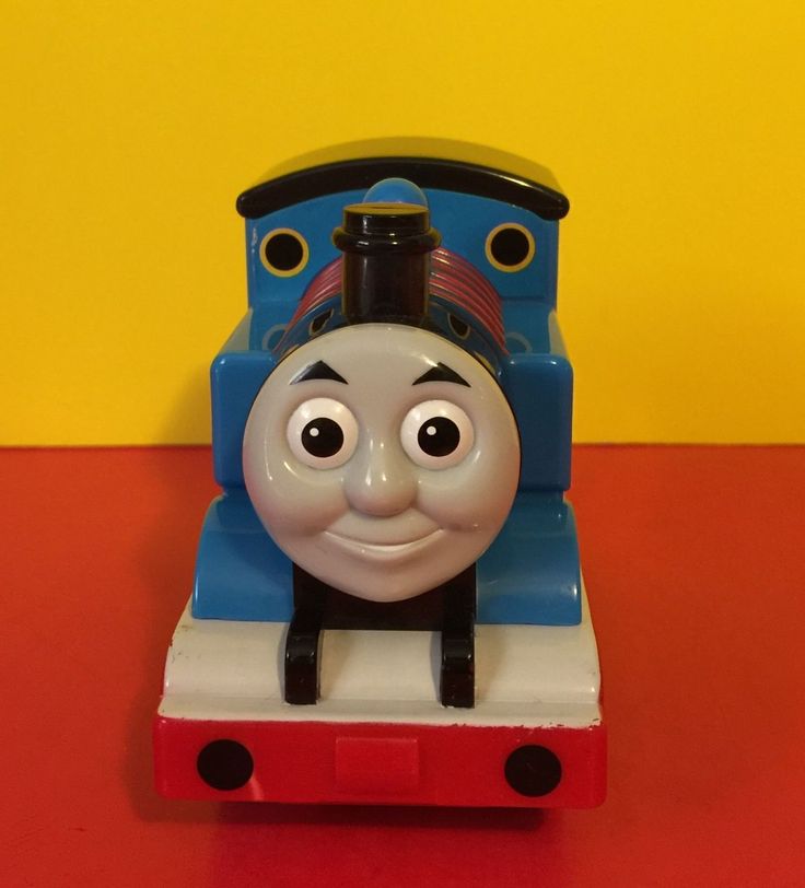 a thomas the train toy sitting on top of a red table