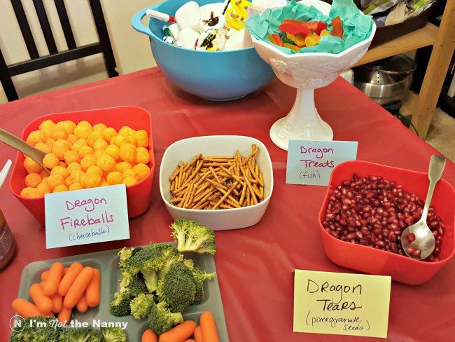 there are many different foods on the table to be eaten at this party, including broccoli, carrots, cranberries and other vegetables