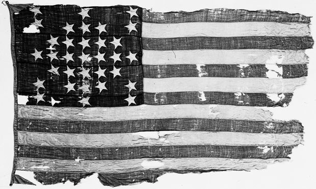 an old american flag is shown in black and white