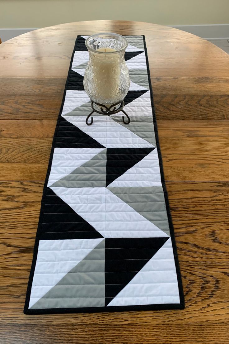 a table runner with a candle on it