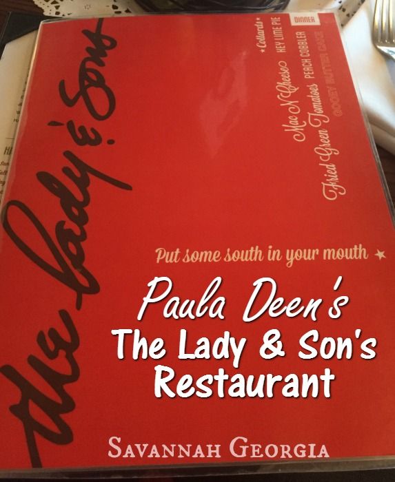 the lady and son's restaurant sign is on top of a table with silverware