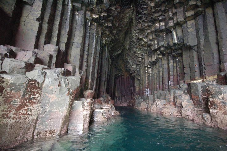 the inside of a cave with water in it