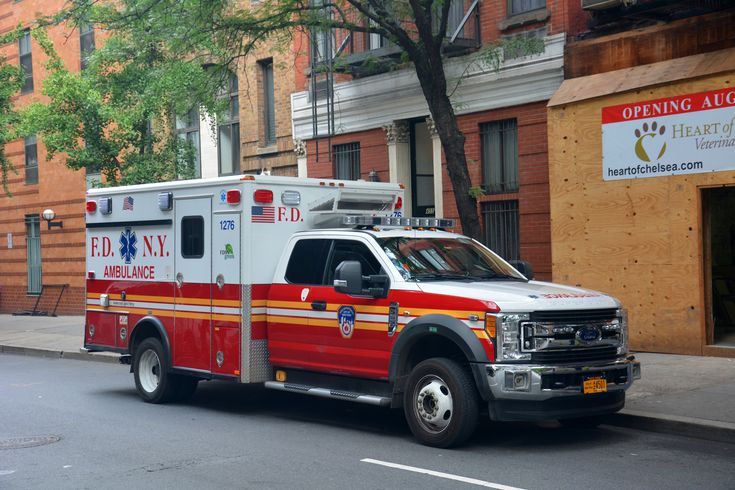 an ambulance is parked on the side of the street