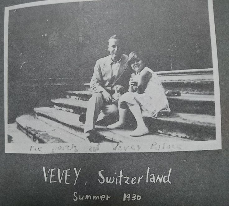 an old black and white photo of two people sitting on steps with the caption very, switzerlandland