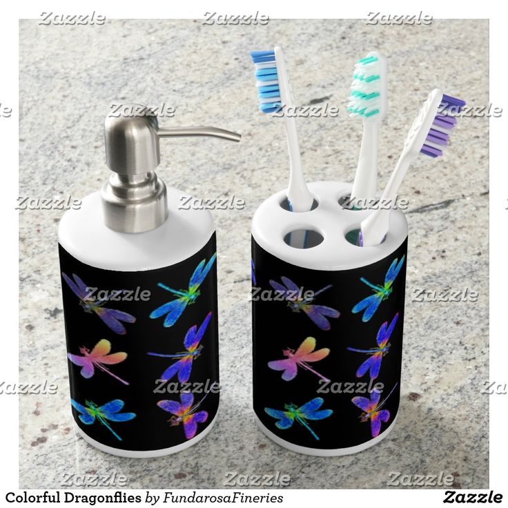 two toothbrush holders with black and white designs