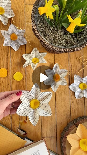 someone is making paper flowers out of old book pages