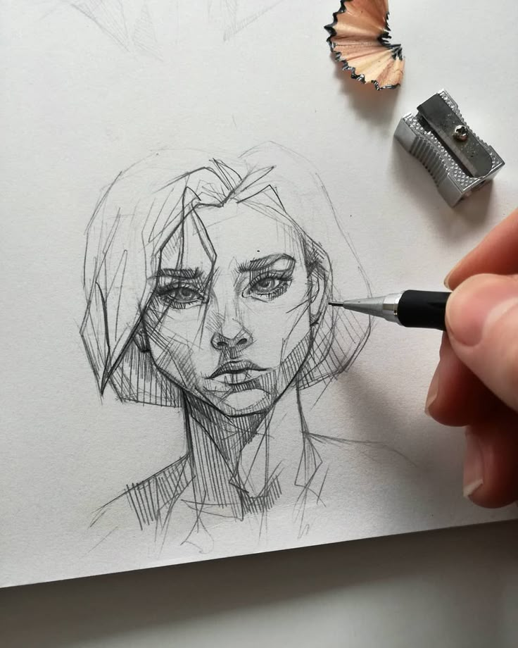 a drawing of a woman's face is being drawn by a person with a pencil