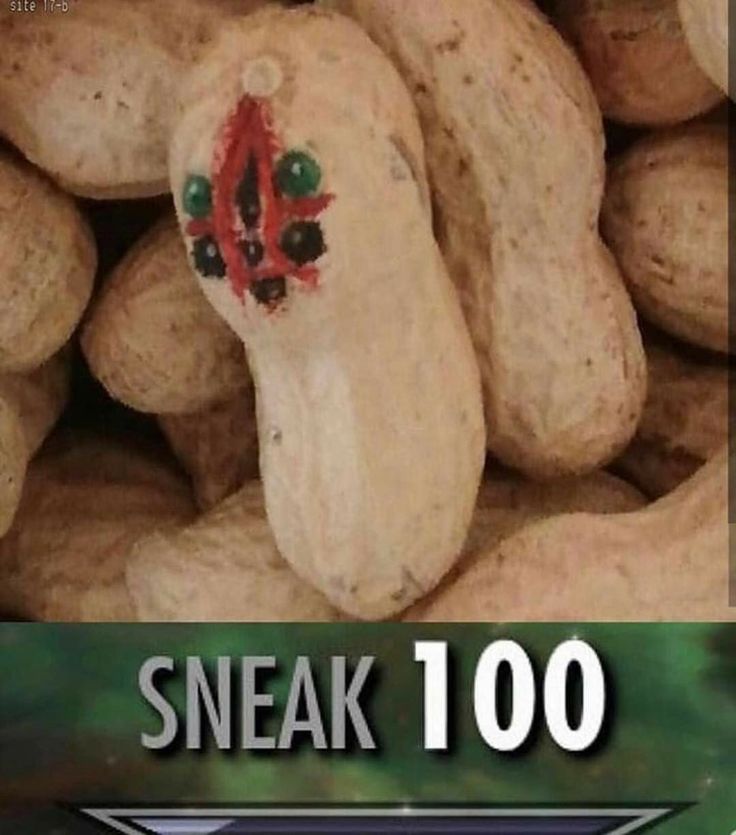 a pile of peanuts sitting next to each other on top of a green sign that says sneak 100