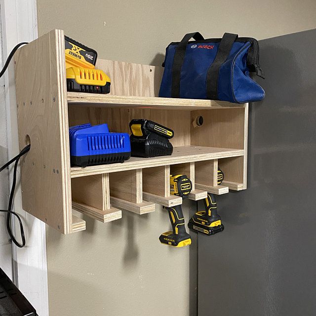 a work bench with tools hanging on it