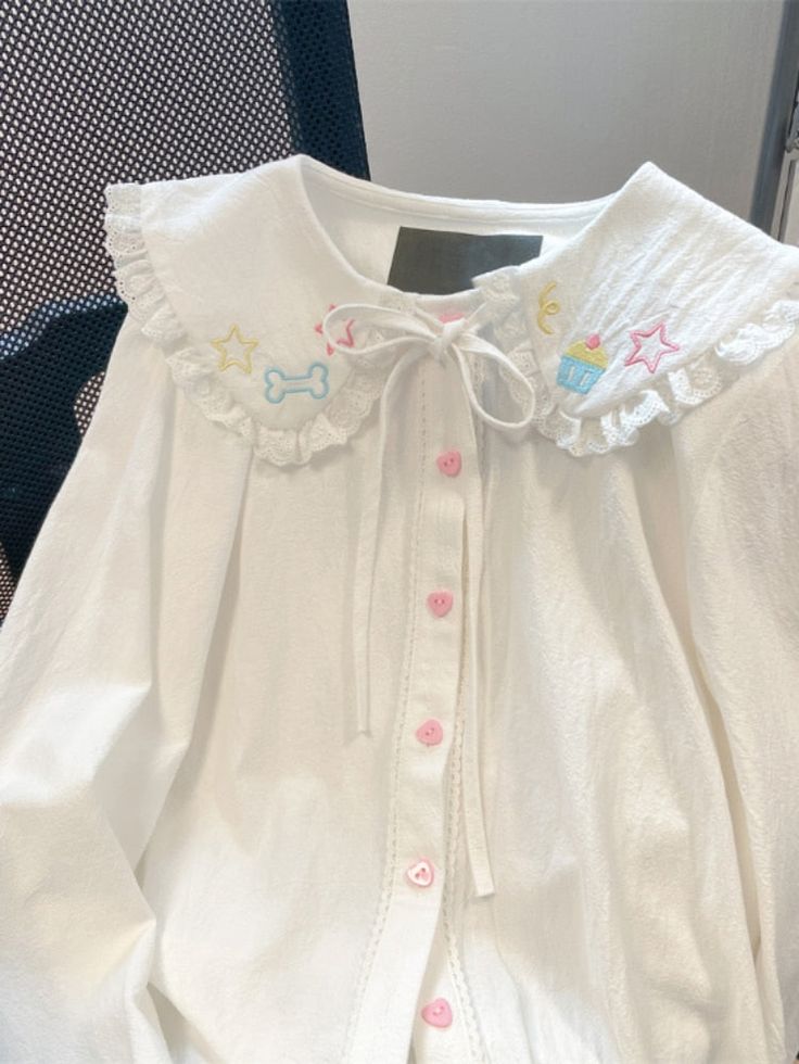 This Kawaii Embroidery Lace Blouse is perfect for any special occasion. Crafted from luxurious eyelash lace, this semi-sheer blouse is an elegant addition to your wardrobe. With a unique embroidery detail, it adds a touch of style and sophistication. this top is sure to move you from ordinary to extraordinary. White Cotton Blouse With Cute Collar, Casual White Blouse With Doll Collar, Cute White Blouse With Doll Collar, Spring Kawaii Top With Doll Collar, Kawaii Spring Top With Doll Collar, White Blouse With Doll Collar In Cute Style, White Casual Blouse With Cute Collar, Casual White Blouse With Cute Collar, Cute Long Sleeve Cotton Blouse