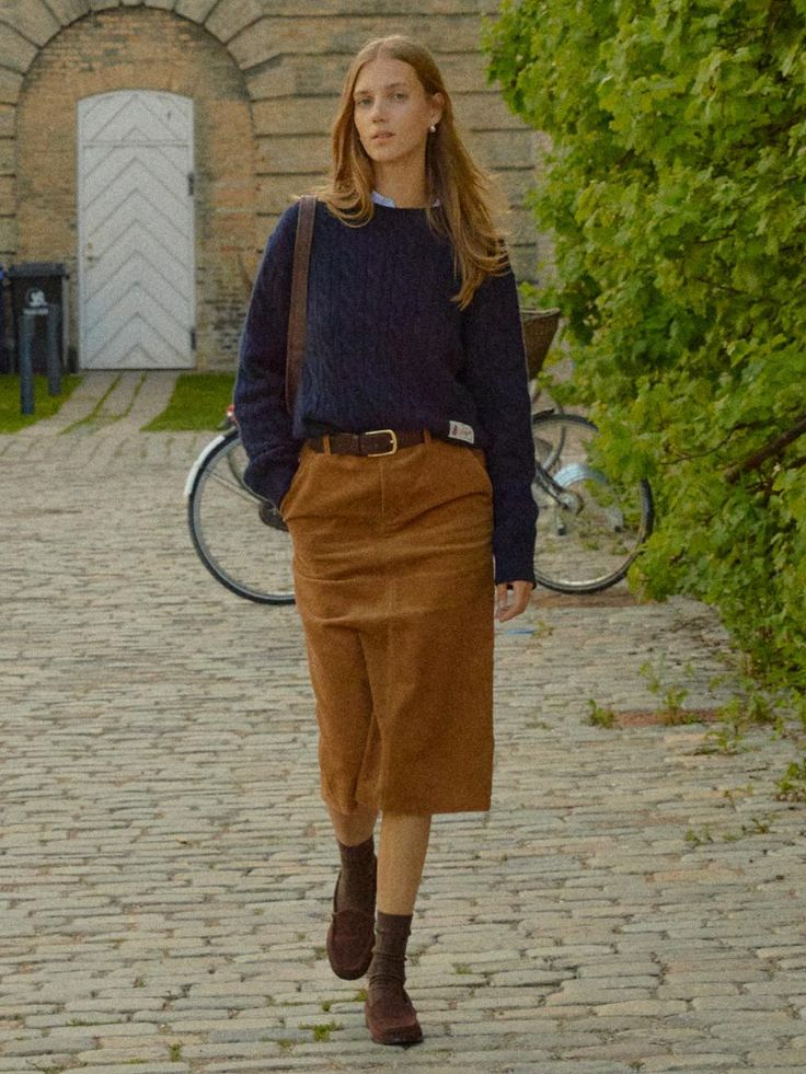 The Randers Pencil Corduroy Skirt is a versatile piece that combines classic corduroy material with a modern design. It features the semi low-rise H-line skirt made of sturdy corduroy material.- Medium length for slim body coverage- Side pockets and back pockets- Completed with contrasting detail inside the waistband for a polished look* The actual color of the product is the most similar to the product cut. Midi Suede Skirt, Tan Courderoy Skirt Outfits, Curdoroy Outfit Womens, Corduroy Long Skirt Outfit, Tan Skirt Outfit Fall, Blue Corduroy Skirt Outfit, Brown Courdory Skirt Outfit, Everyday Skirt Outfits, Courderoy Skirt Outfits Women