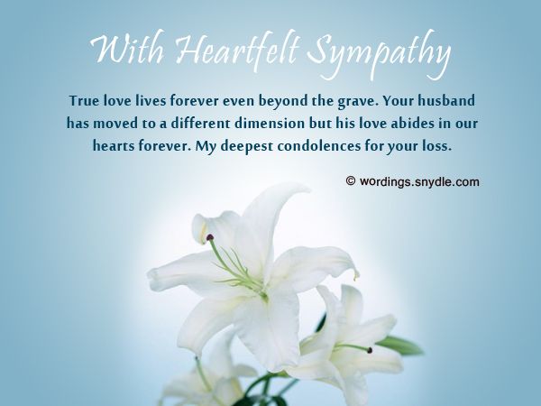 a vase with white lilies in it on a blue background that says, with heartful sympathy