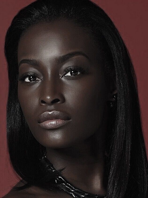 a woman with dark skin and long black hair