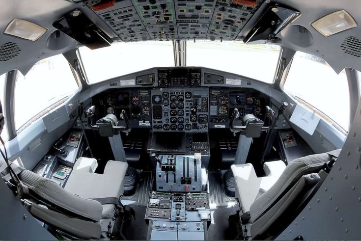 the cockpit of an airplane with multiple controls