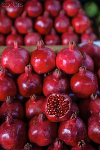 the pomegranates are piled on top of each other