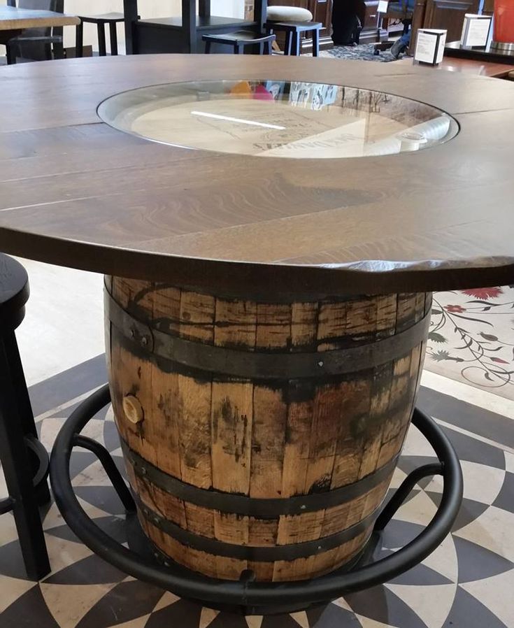 a table made out of an old barrel