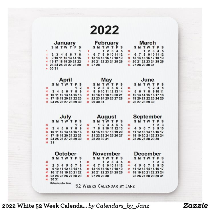 a white calendar with red numbers on it