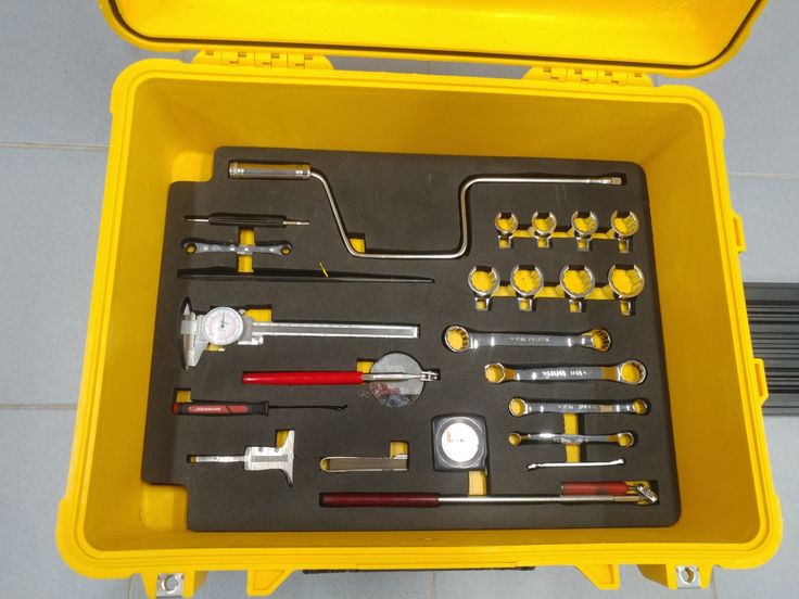 a yellow tool box filled with different tools