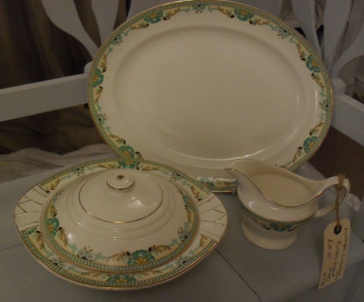 an antique porcelain dish and saucer on display