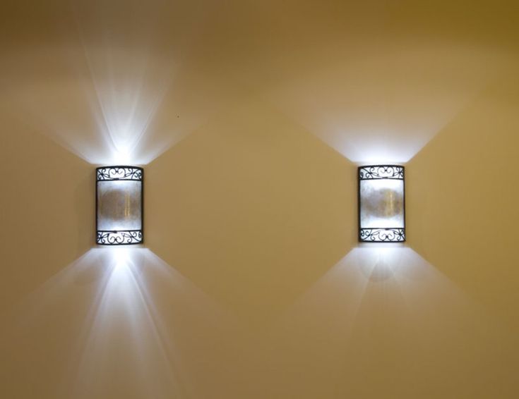 two square lights are shining on the wall