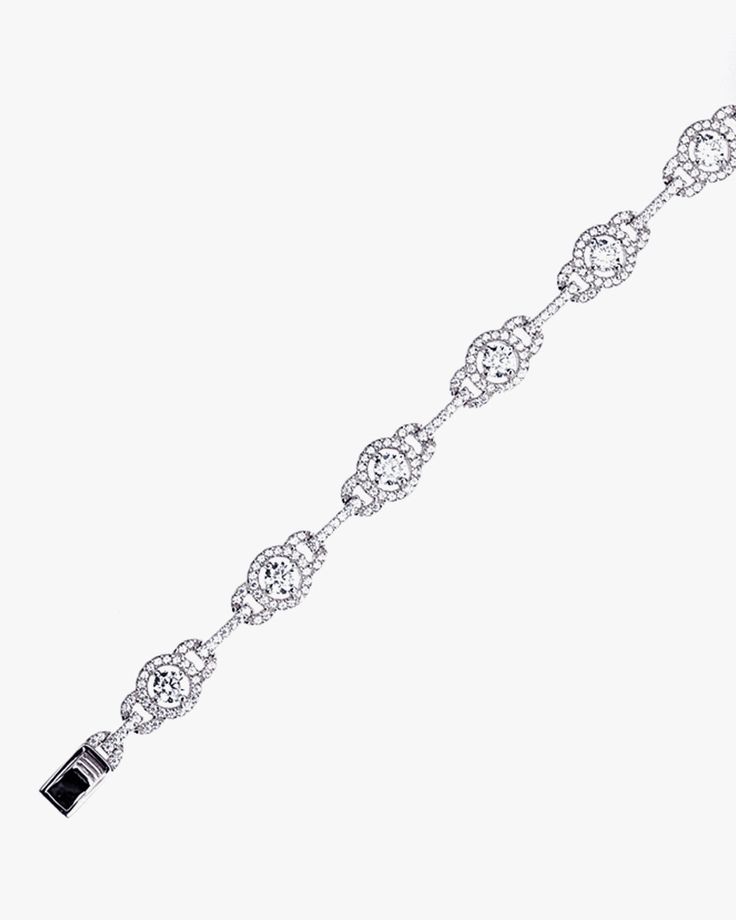 - Halo and Link Bracelet with sterling silver- Made in Sterling silver set with a high-quality Cubic Zirconia. - Stone size: 4.00 mm, 1.10 mm- Length: 7 inch Sterling silver925 Sterling Silver is an alloy made of 92.5% pure silver and 7.5% copper. We plate our silver jewelry in rhodium, which gives it extra shine and durability. Rhodium is one of the costliest precious metals due to its rarity.CareH2O sensitive. Avoid water when wearing your piece, because over time the sterling silver will oxid Sterling Silver Diamond Cut Tennis Bracelet, Sterling Silver Cubic Zirconia Bracelet For Anniversary, Elegant Adjustable Sterling Silver Bracelet With Polished Finish, Hand Set Sterling Silver Bracelet In White Gold, Elegant Sterling Silver Bracelet With Polished Finish, Hand Set White Gold Sterling Silver Bracelet, Sterling Silver Tennis Bracelet With Diamond Accents, Classic Silver Bracelet Jewelry, Classic Silver Chain Bracelet For Formal Occasions