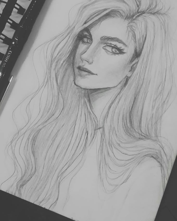 a pencil drawing of a woman with long hair