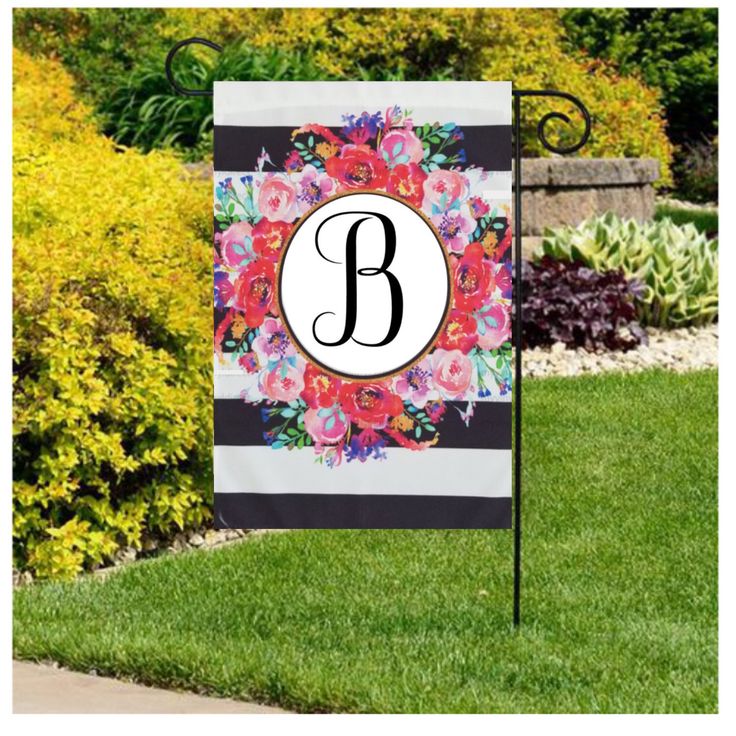 a garden flag with the letter b on it