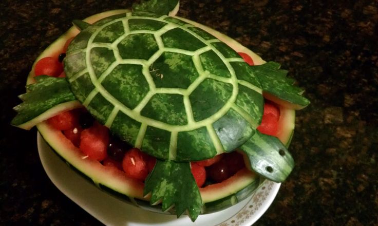 a turtle made out of watermelon on a plate